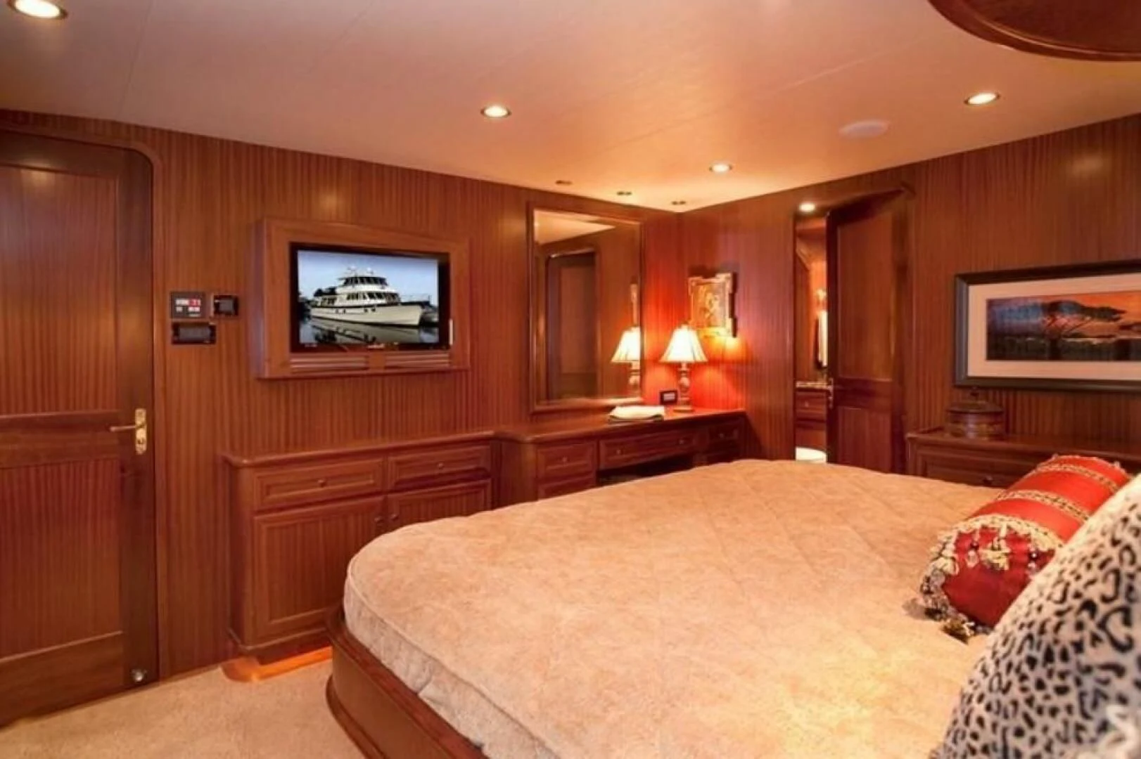 a hotel room with a bed and television aboard AL DI LA Yacht for Sale