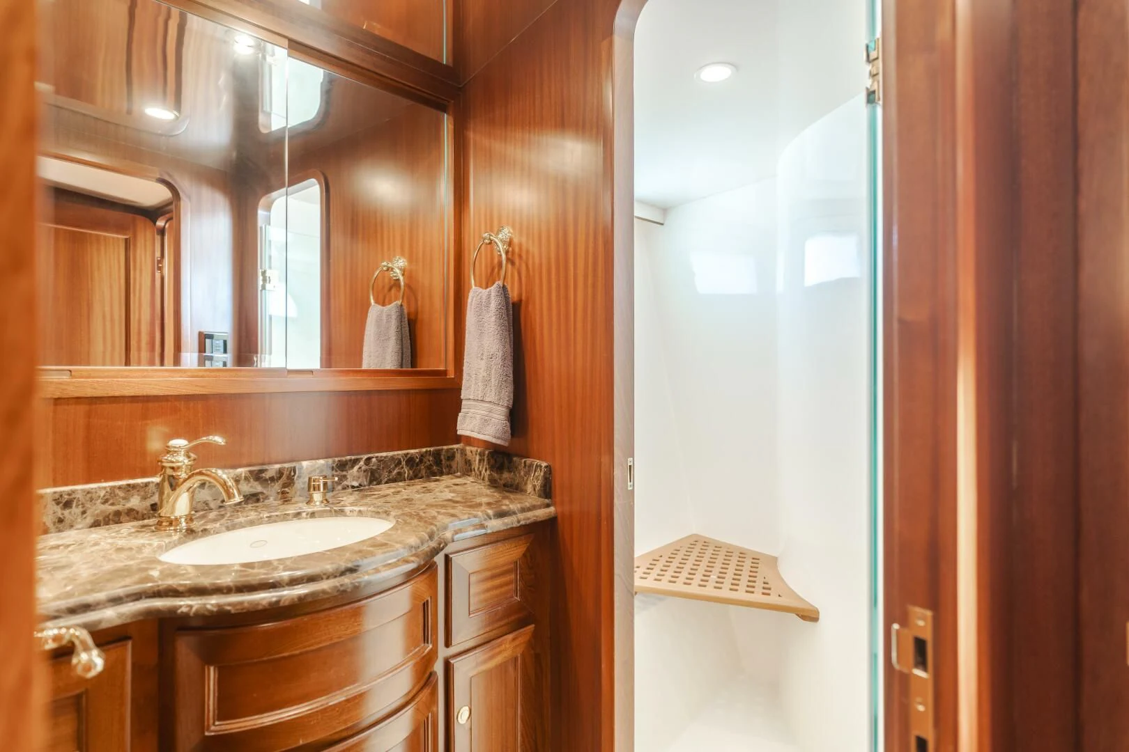 a bathroom with a sink and a mirror aboard AL DI LA Yacht for Sale