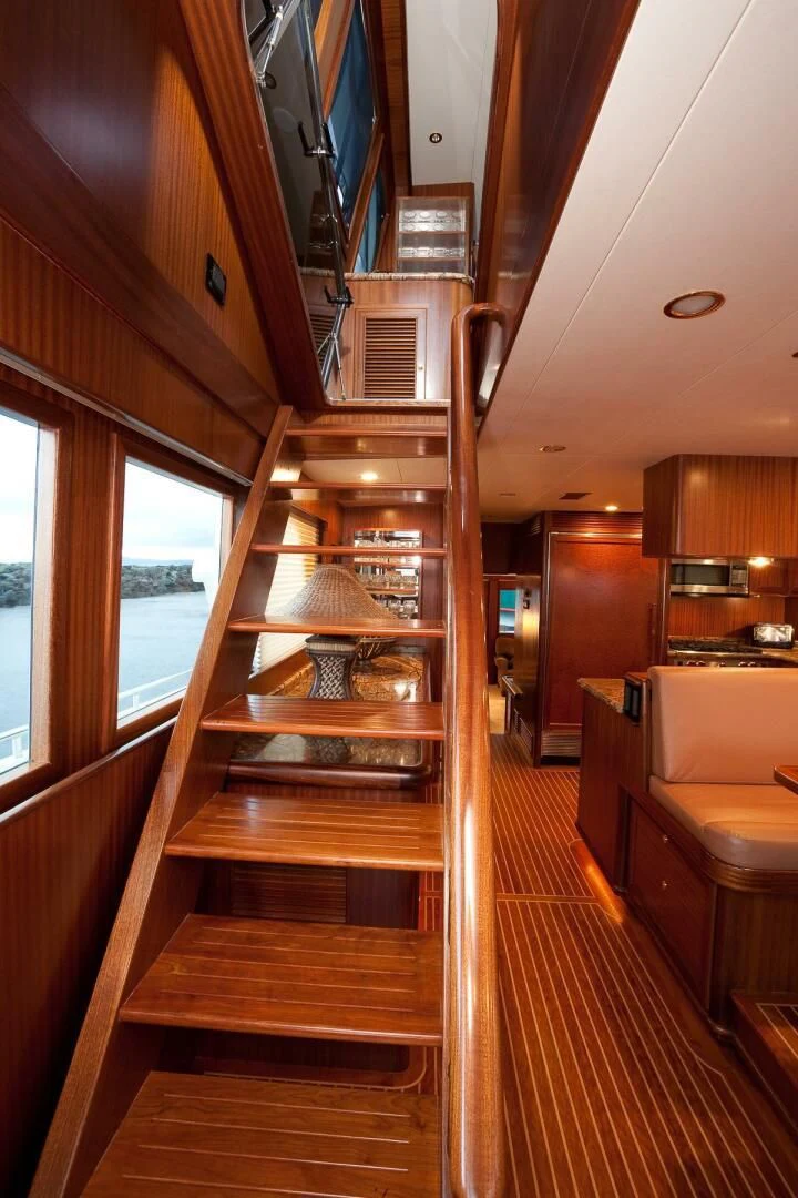 a wood staircase in a house aboard AL DI LA Yacht for Sale