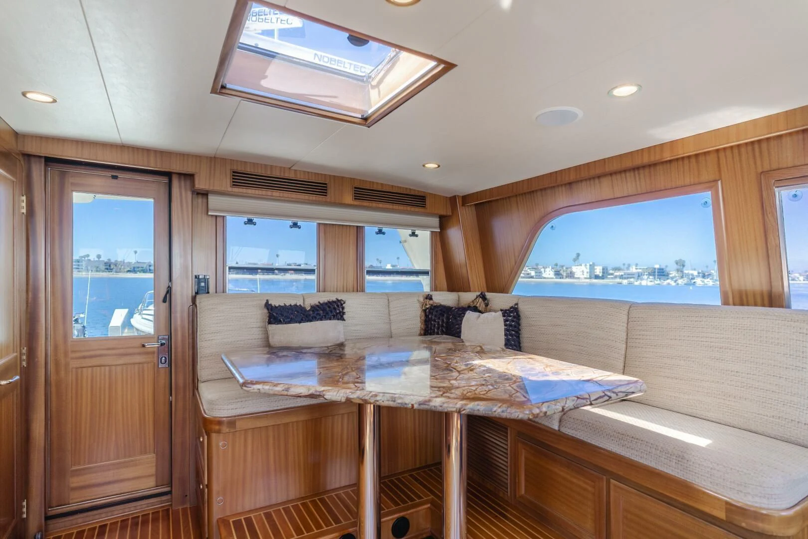 a living room with a couch and a table aboard AL DI LA Yacht for Sale