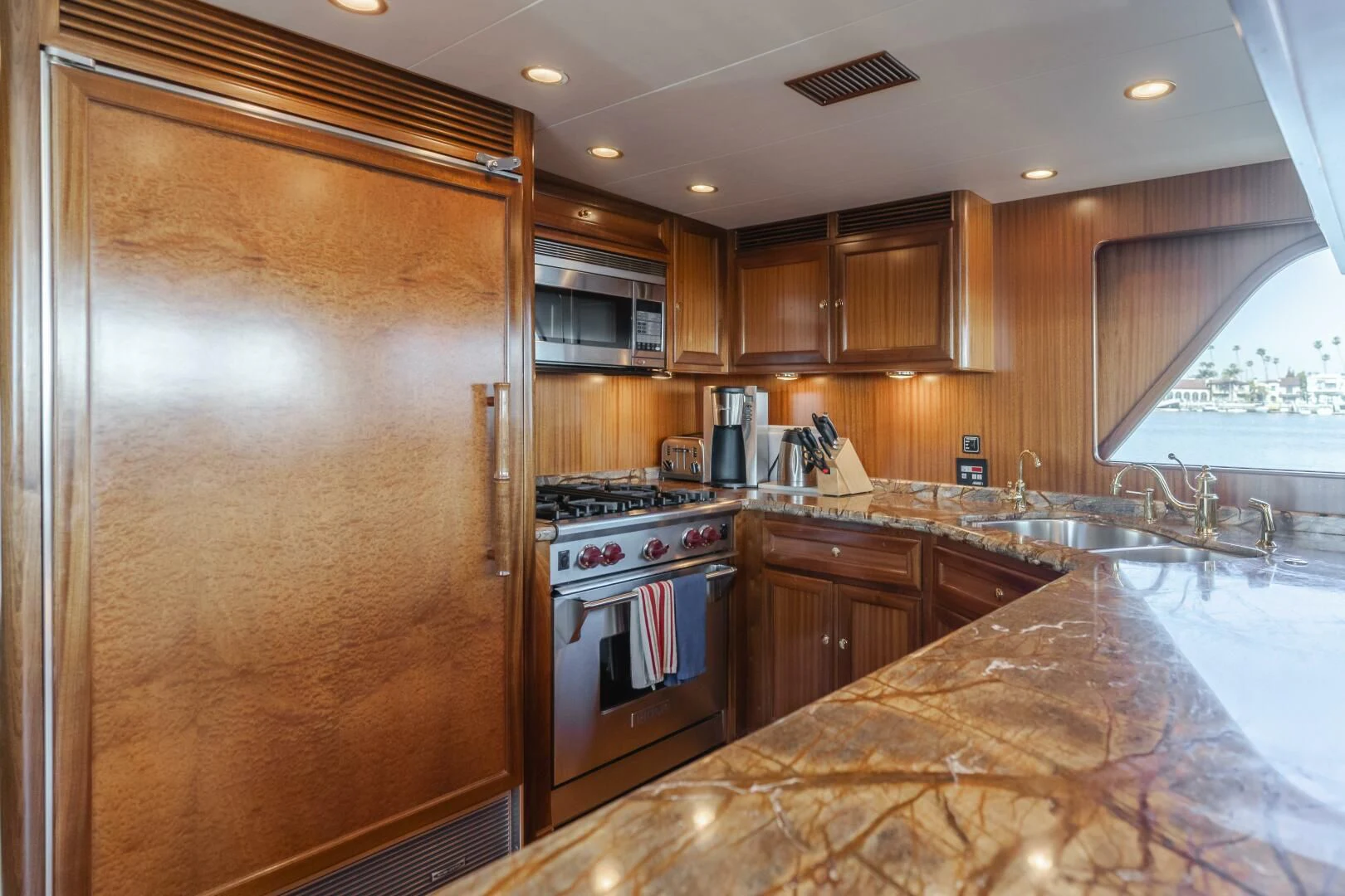 a kitchen with a large island aboard AL DI LA Yacht for Sale