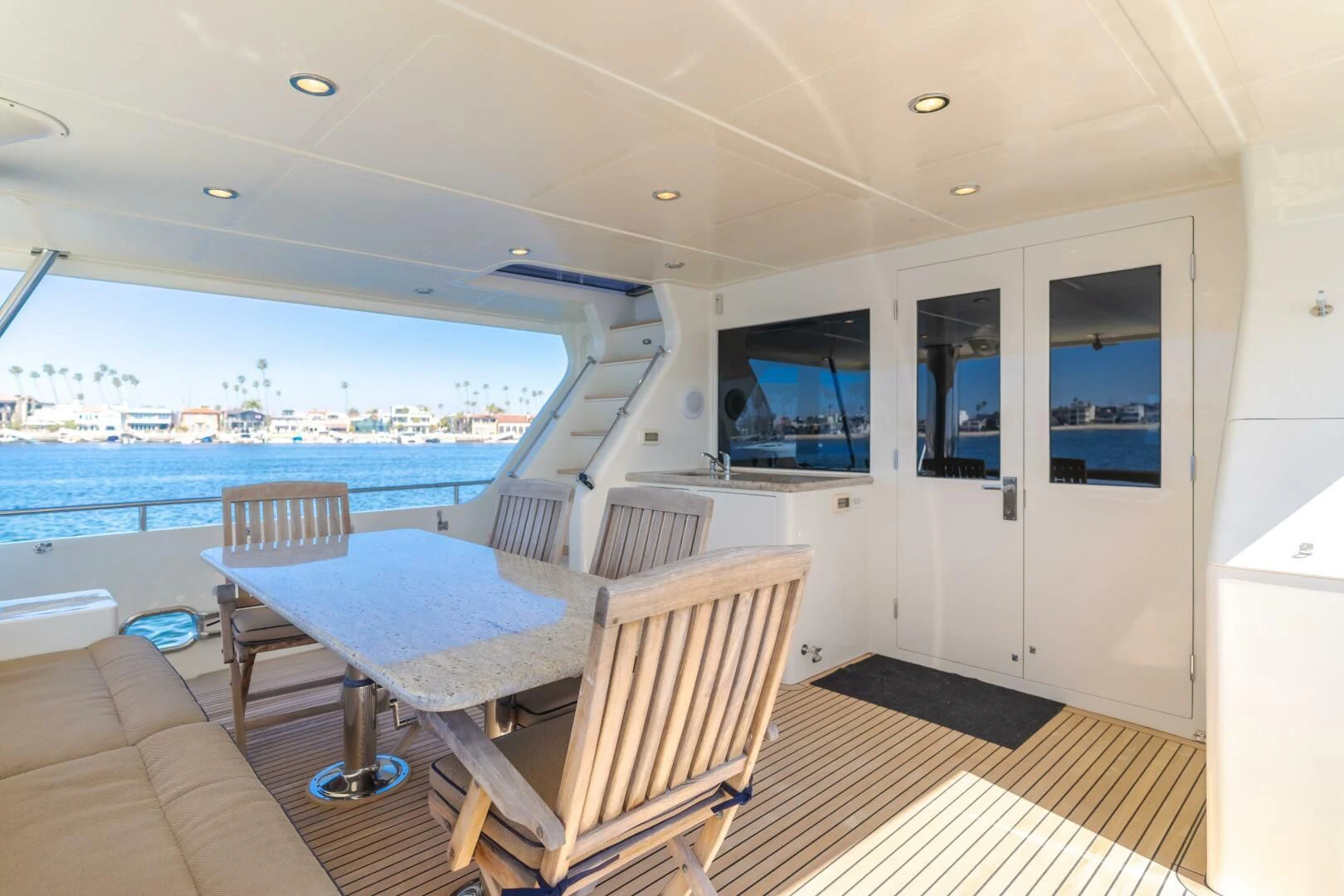a room with a table and chairs aboard AL DI LA Yacht for Sale