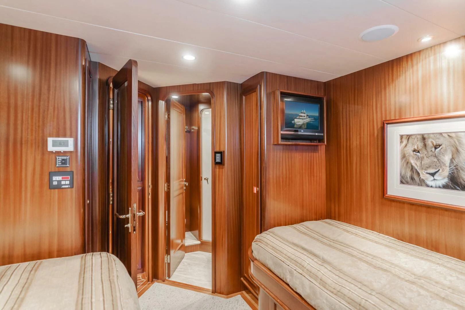 a hotel room with a bed and tv aboard AL DI LA Yacht for Sale