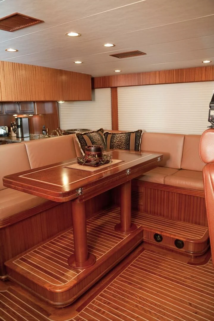 a wood table in a room aboard AL DI LA Yacht for Sale
