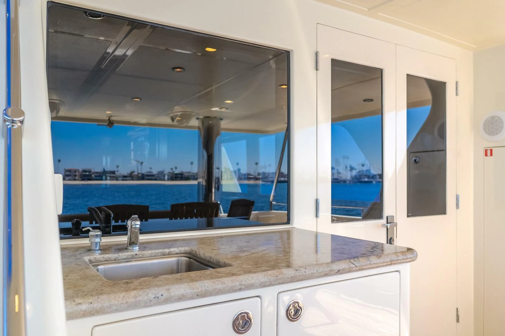 a bathroom with a sink and a large window aboard AL DI LA Yacht for Sale