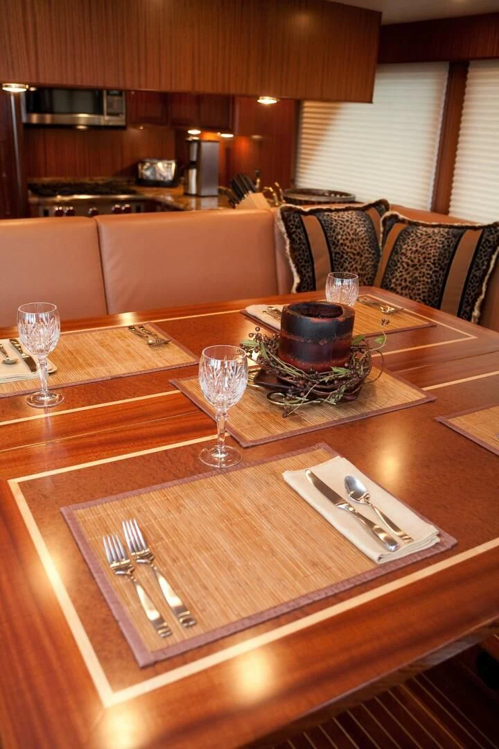 a table with silverware and silverware on it aboard AL DI LA Yacht for Sale