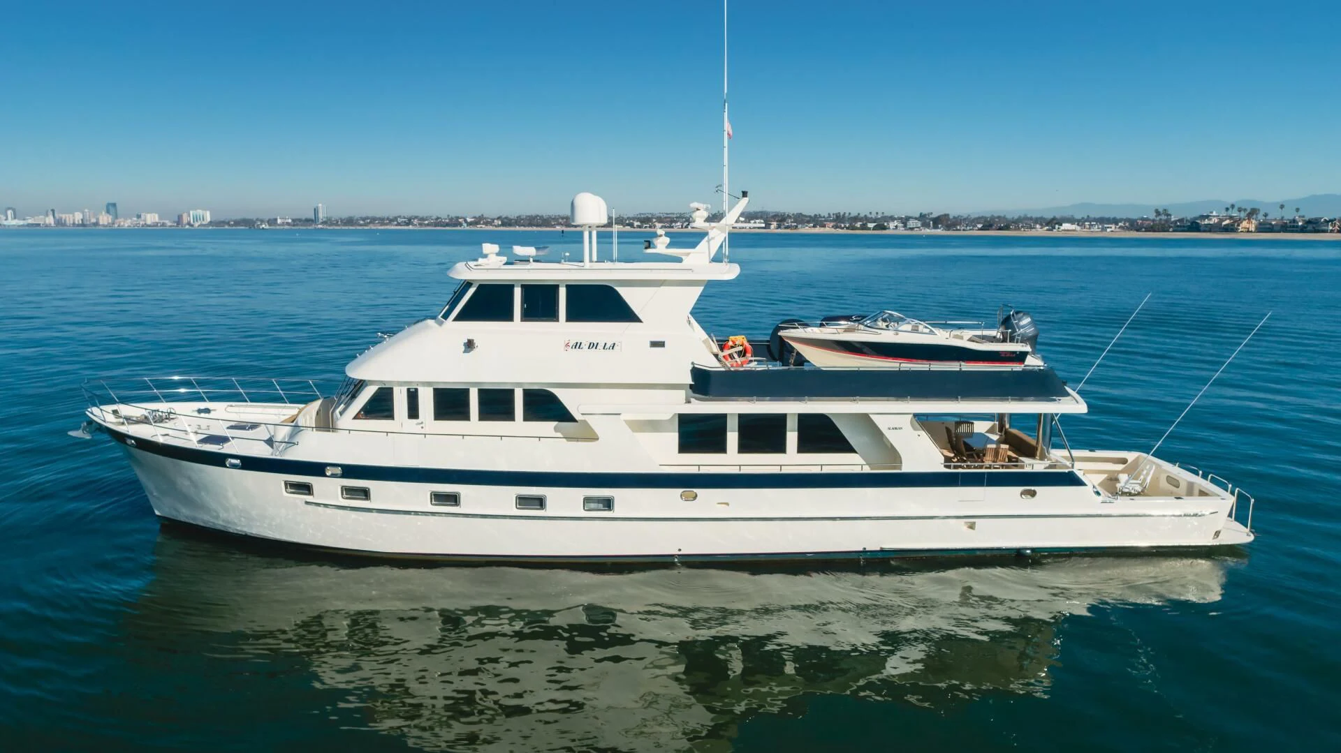 a white yacht in the water aboard AL DI LA Yacht for Sale