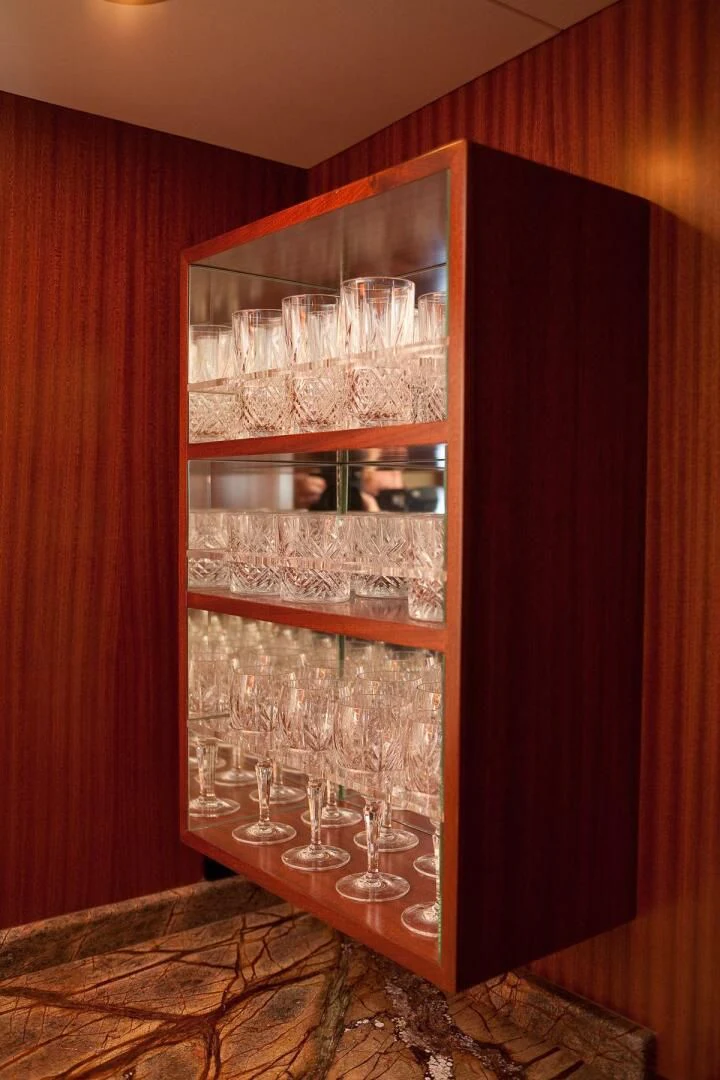 a wine glass on a table aboard AL DI LA Yacht for Sale