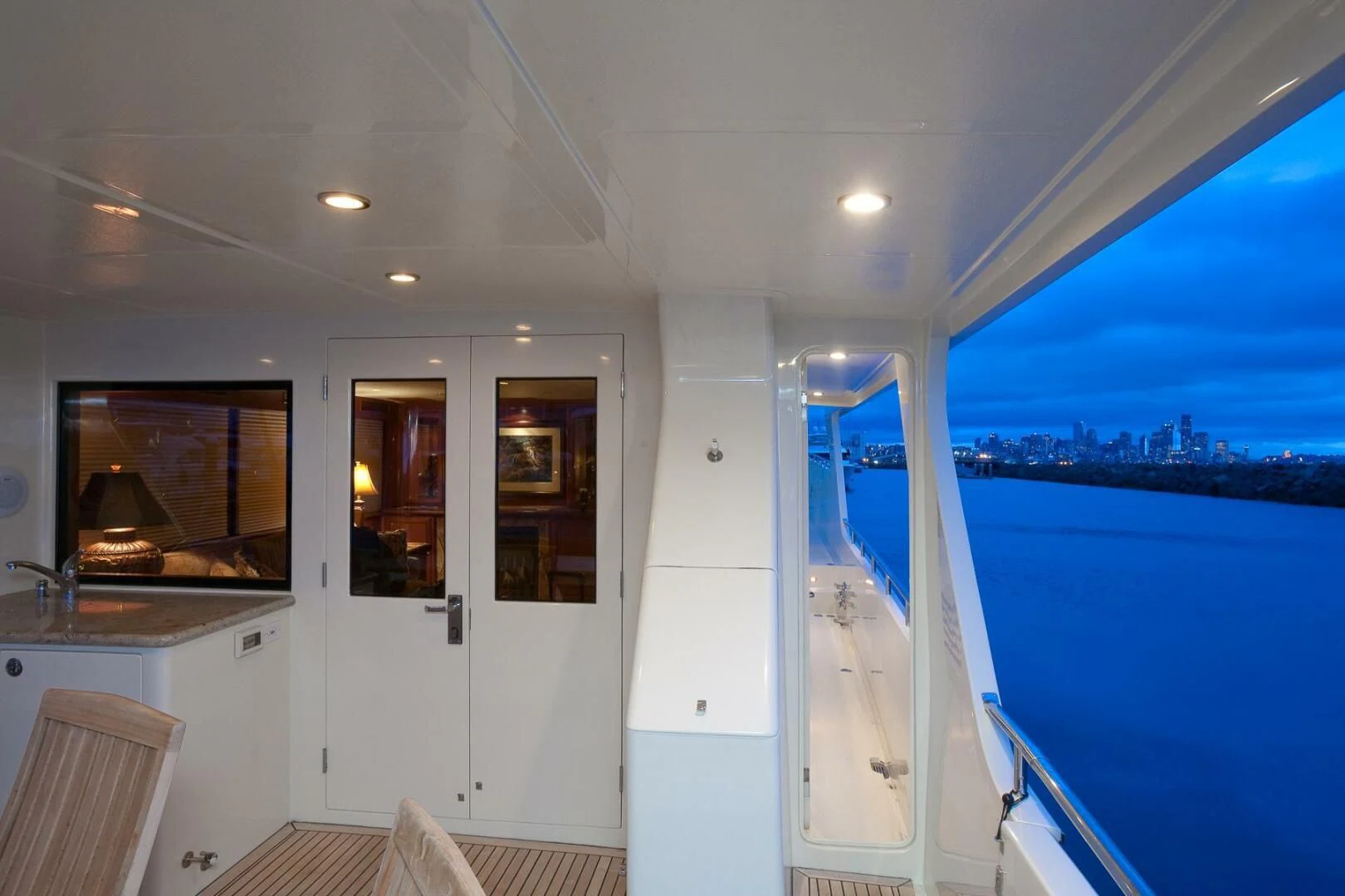a room with a view of the water and the beach aboard AL DI LA Yacht for Sale