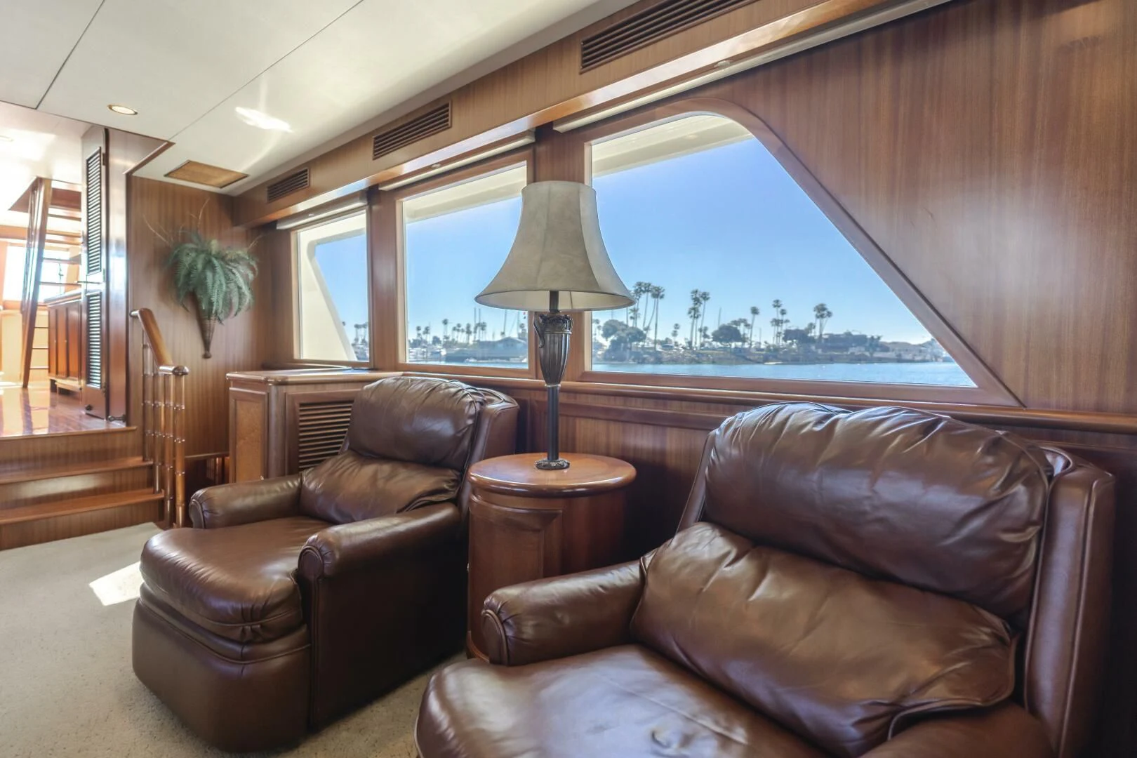 a living room with a large window aboard AL DI LA Yacht for Sale