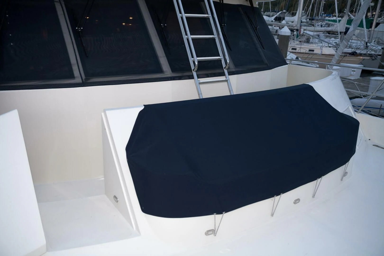 a black umbrella on a white surface aboard AL DI LA Yacht for Sale