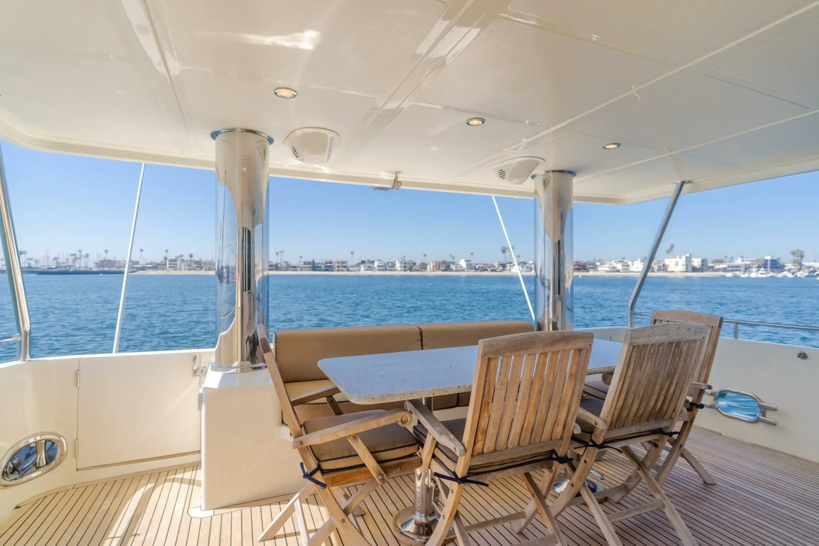 a boat deck with chairs and tables aboard AL DI LA Yacht for Sale