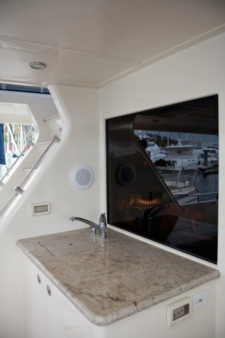 a kitchen with a large marble counter top aboard AL DI LA Yacht for Sale