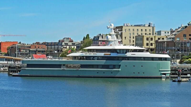 a large white boat in a harbor aboard ANAWA Yacht for Sale