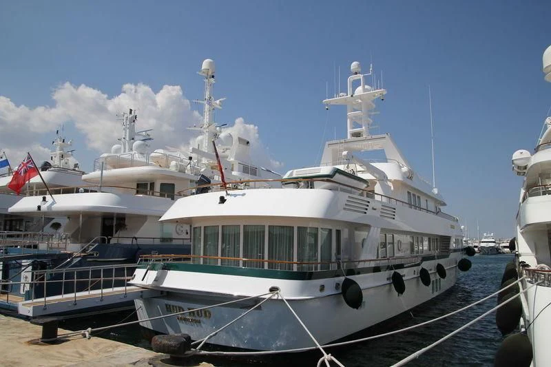 a large white boat docked aboard HUD HUD Yacht for Sale