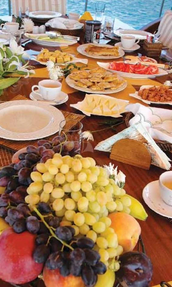 a table full of food aboard SCHATZ Yacht for Sale