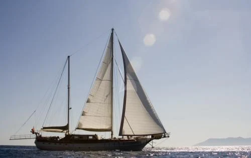 a sailboat on the water aboard SCHATZ Yacht for Sale