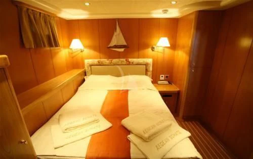 a hotel room with a bed aboard SCHATZ Yacht for Sale
