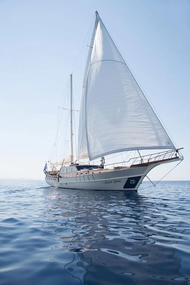 a white boat on the water aboard SCHATZ Yacht for Sale