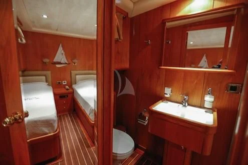 a bathroom with red walls aboard SCHATZ Yacht for Sale