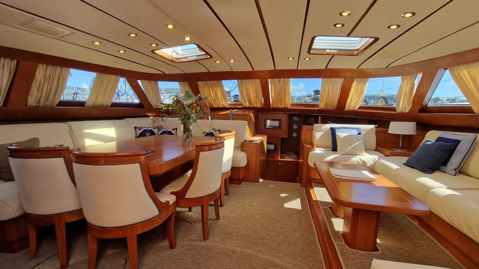 a room with a couch and a table and chairs aboard MEDUSA Yacht for Sale
