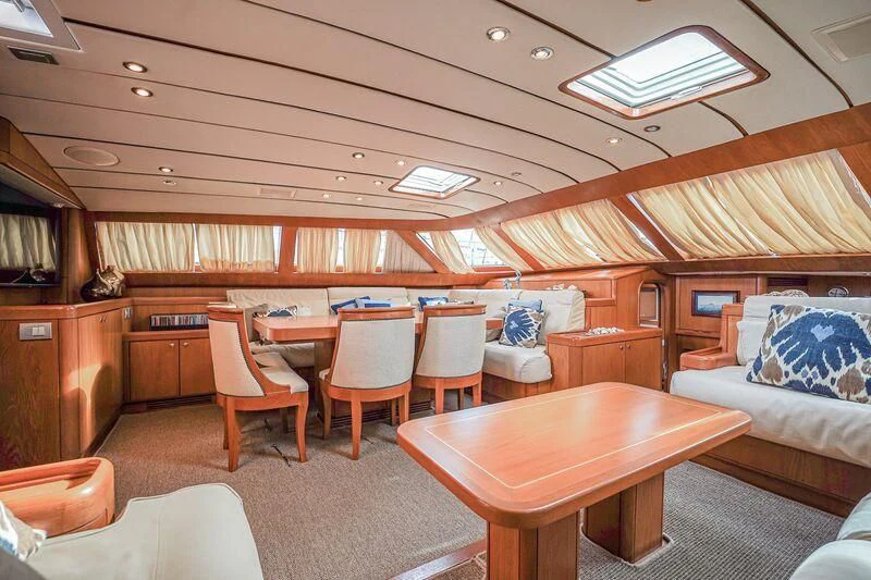 a room with a table and chairs aboard MEDUSA Yacht for Sale