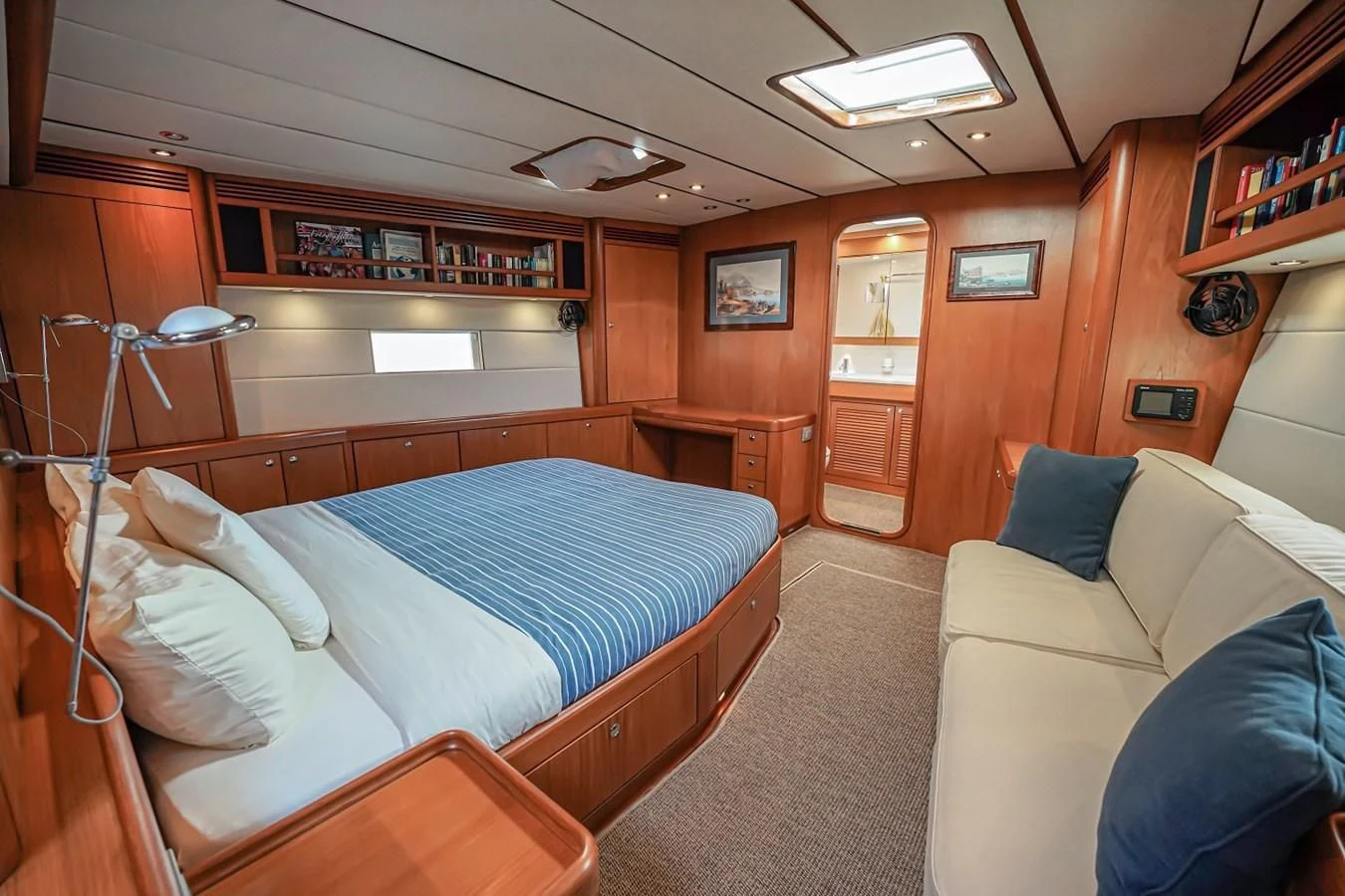 a bedroom with a bed and a couch aboard MEDUSA Yacht for Sale