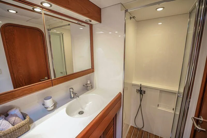 a bathroom with a large mirror aboard MEDUSA Yacht for Sale