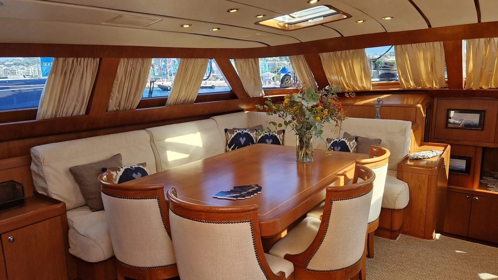 a room with a table and chairs aboard MEDUSA Yacht for Sale