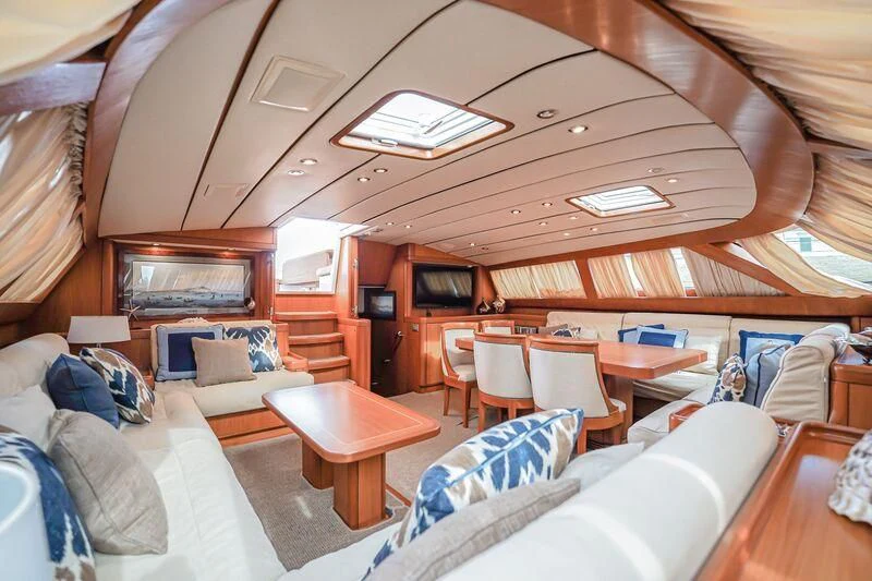 a living room with a couch and a table aboard MEDUSA Yacht for Sale