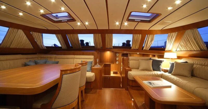 a room with a bed and a couch aboard MEDUSA Yacht for Sale