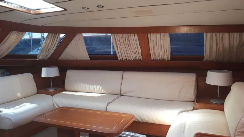 a room with a couch and a table aboard MEDUSA Yacht for Sale