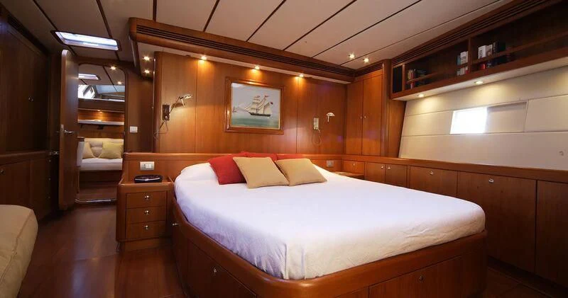 a room with a bed and a desk aboard MEDUSA Yacht for Sale