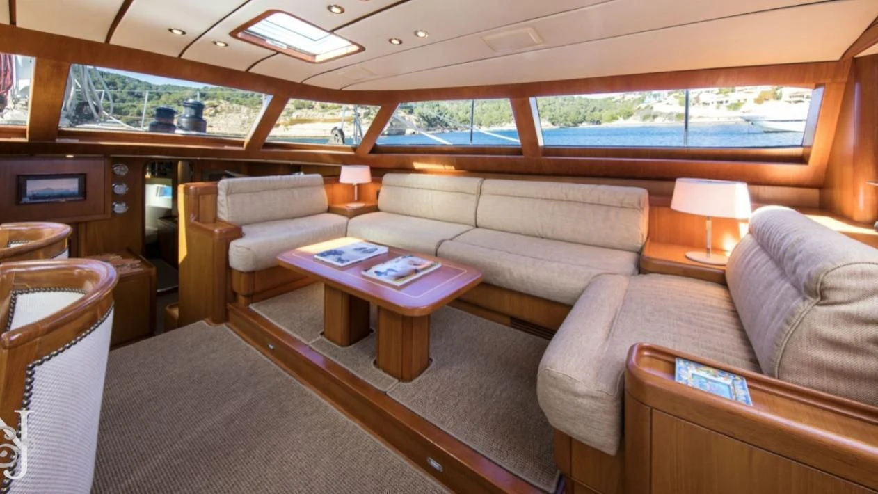 a living room with a couch and a table aboard MEDUSA Yacht for Sale