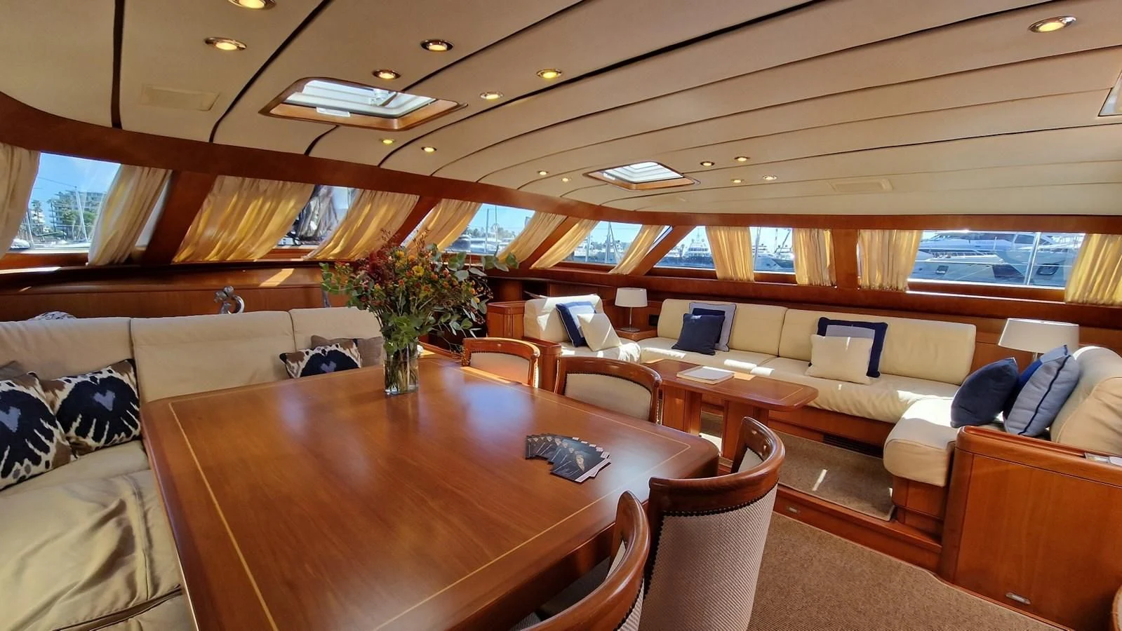 a room with a table and couches aboard MEDUSA Yacht for Sale