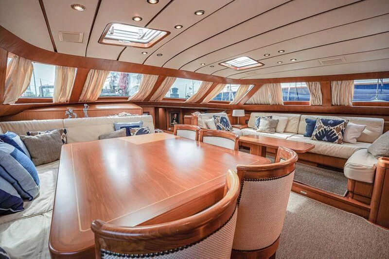 a room with a table and couches aboard MEDUSA Yacht for Sale