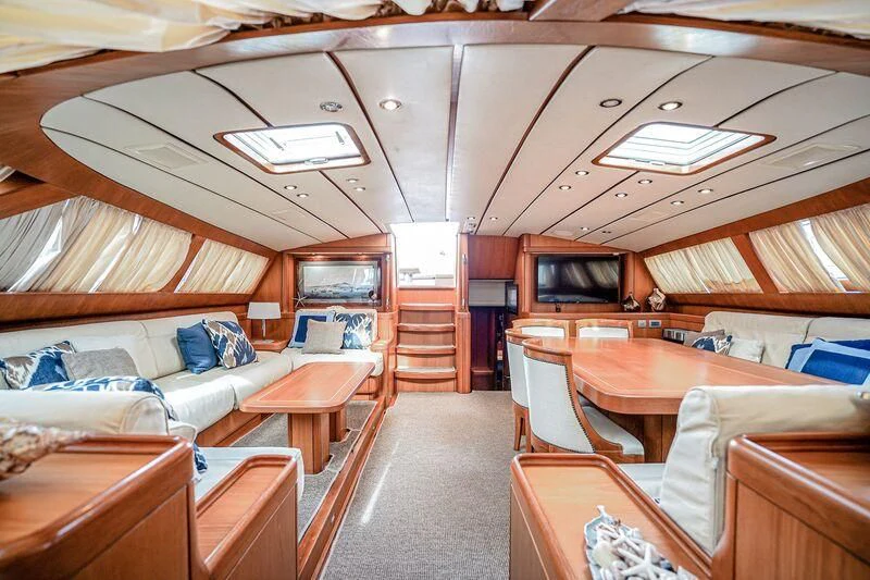 a room with a bed and a table aboard MEDUSA Yacht for Sale
