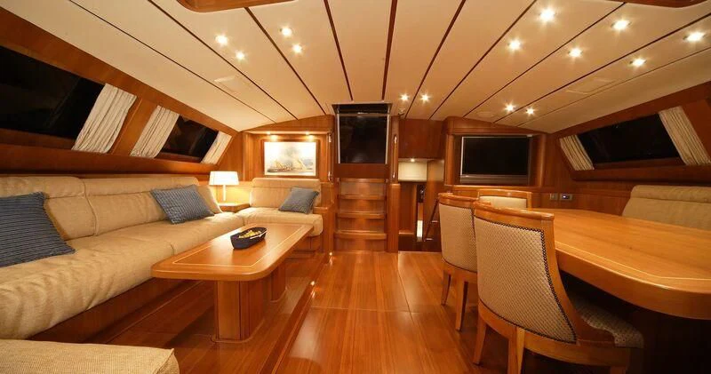 a living room with a wood floor aboard MEDUSA Yacht for Sale