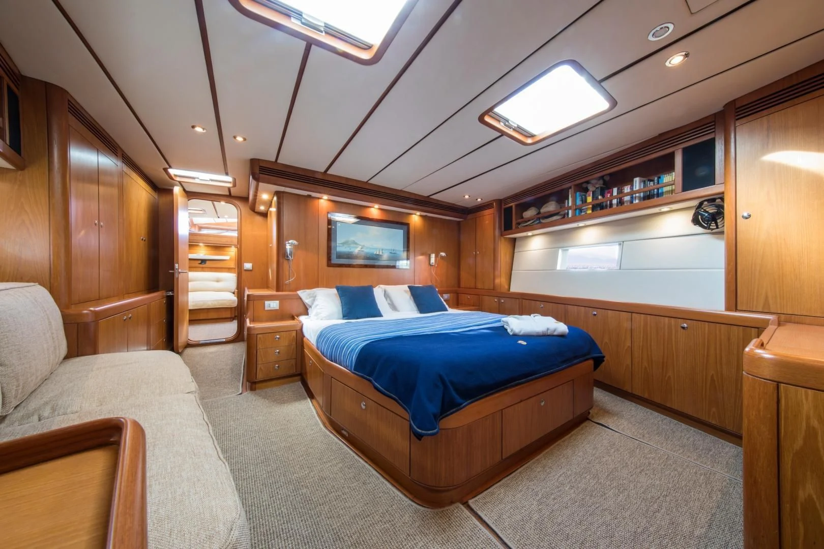 a bedroom with a bed and a couch aboard MEDUSA Yacht for Sale