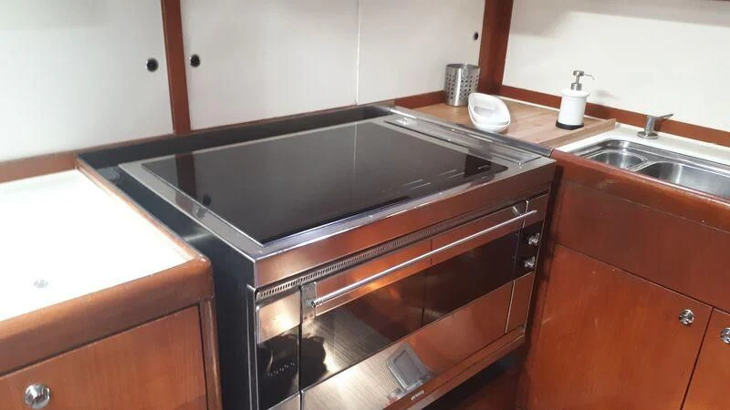 a kitchen with a stainless steel stove aboard MEDUSA Yacht for Sale