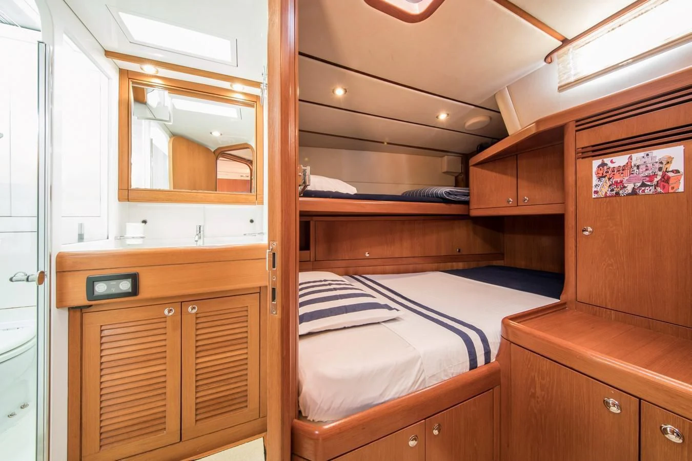 a bedroom with wooden furniture aboard MEDUSA Yacht for Sale