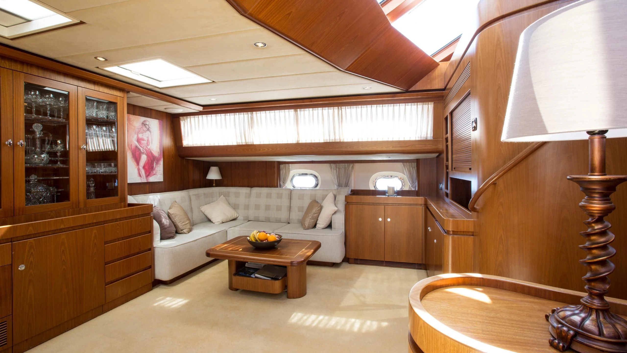 a living room with a couch and a table aboard INFATUATION Yacht for Sale