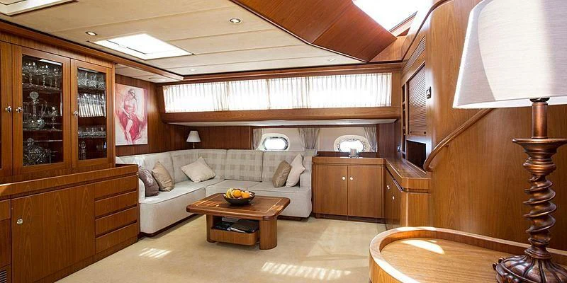 a living room with a couch and a table aboard INFATUATION Yacht for Sale