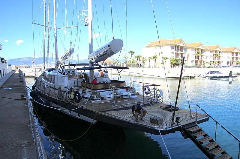 a boat docked at a pier aboard INFATUATION Yacht for Sale