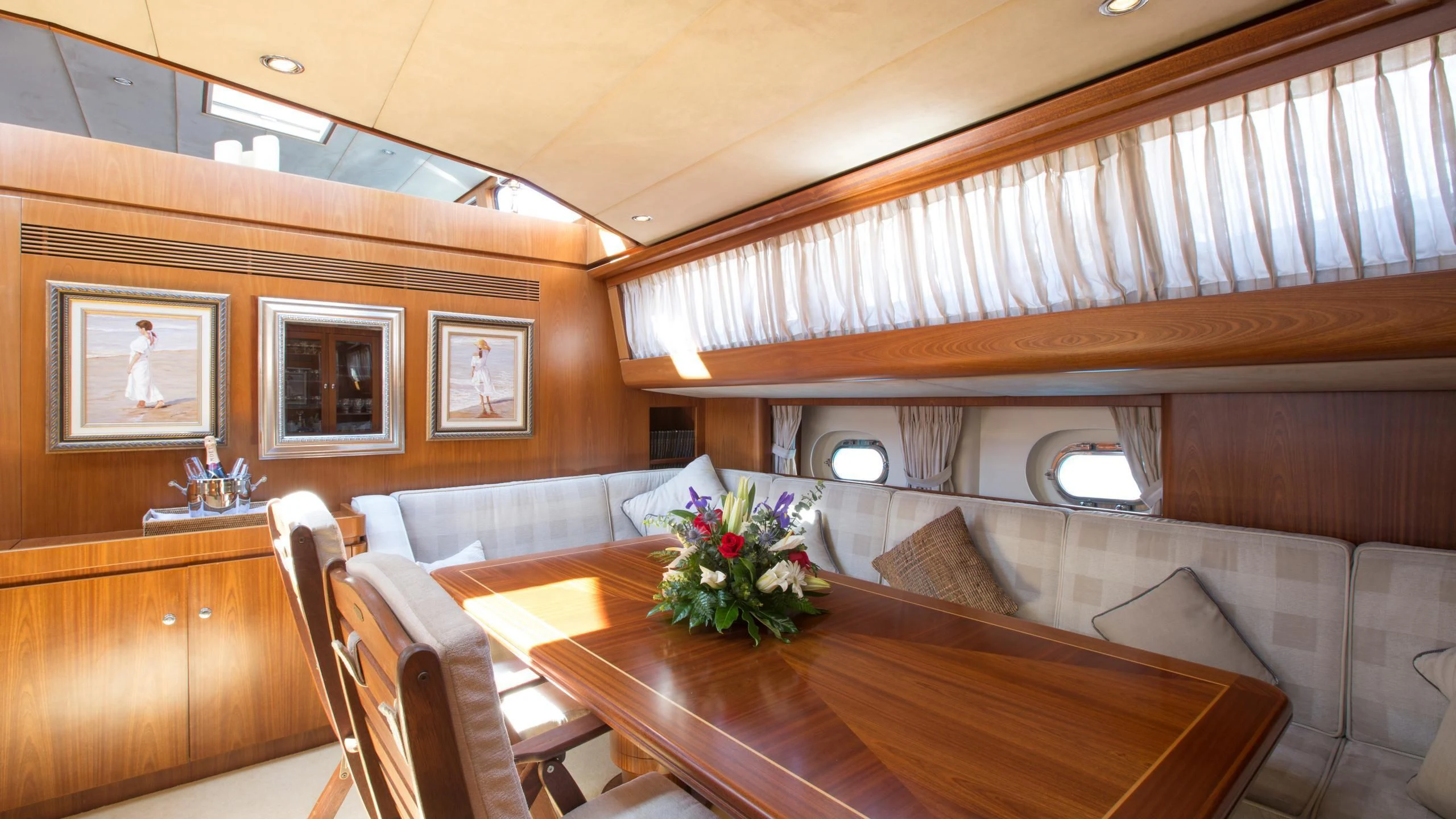 a room with a table and chairs aboard INFATUATION Yacht for Sale