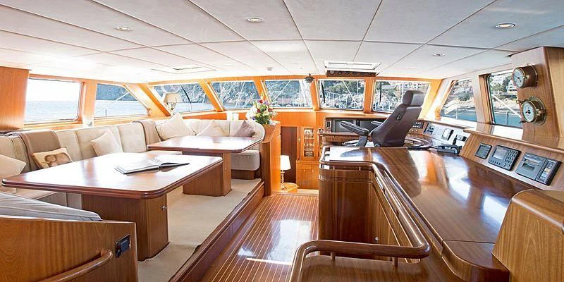 a room with a table and chairs aboard INFATUATION Yacht for Sale