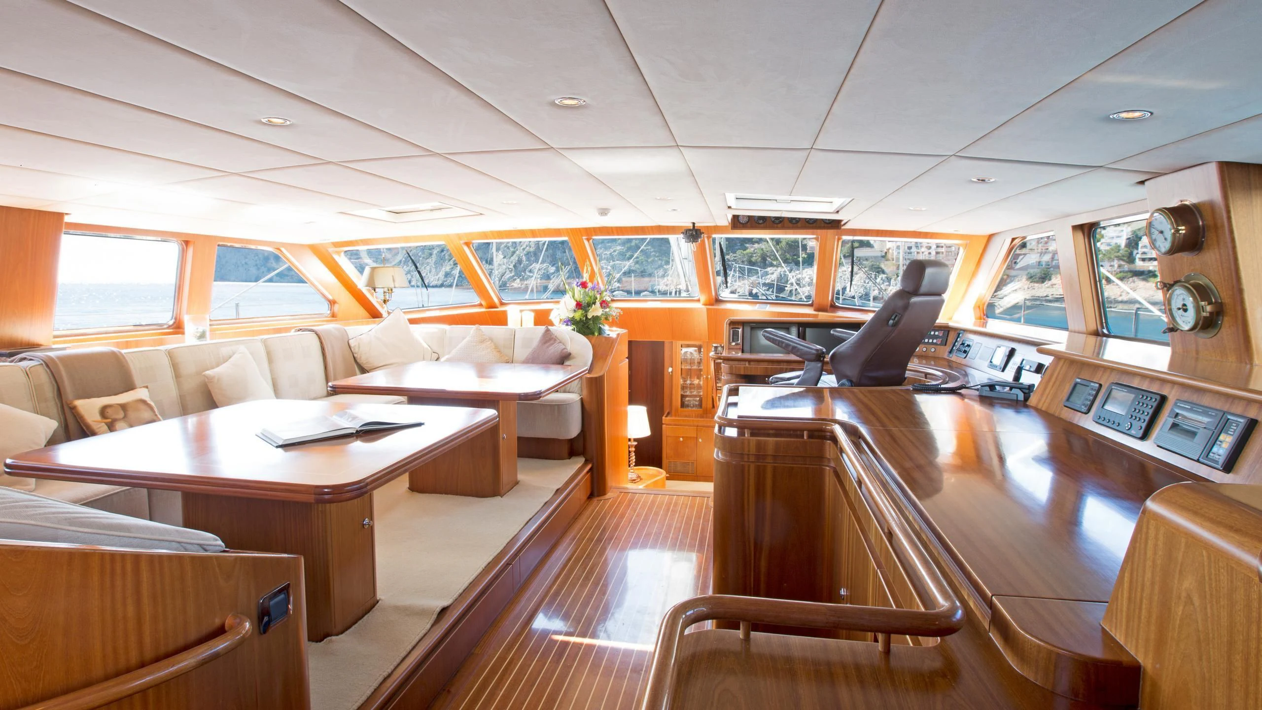 a room with a table and chairs aboard INFATUATION Yacht for Sale