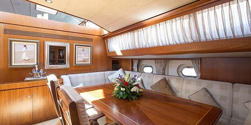 a room with a couch and a table aboard INFATUATION Yacht for Sale