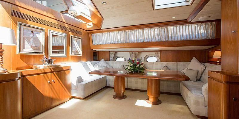 a room with a couch and a table aboard INFATUATION Yacht for Sale