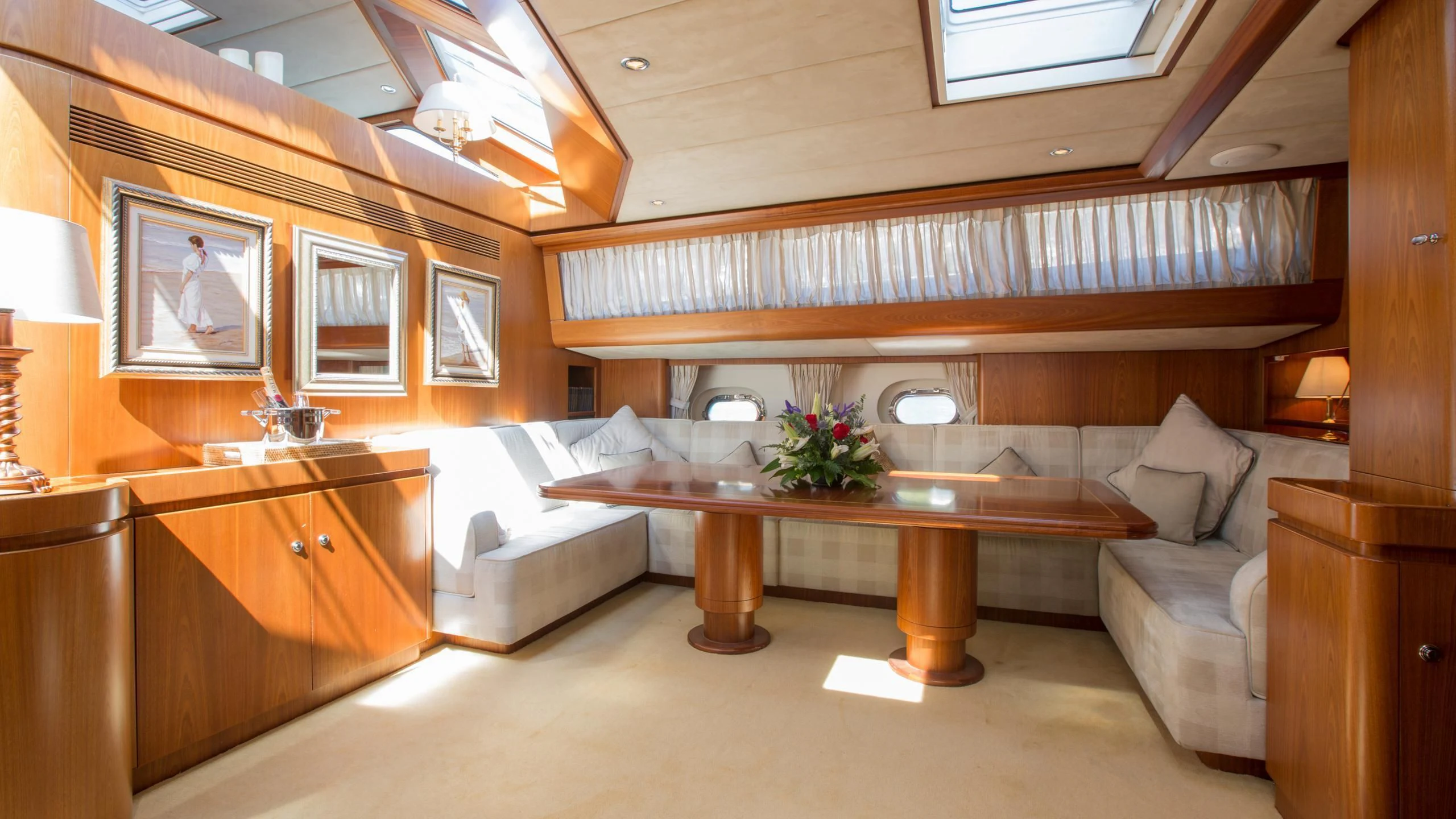 a room with a couch and a table aboard INFATUATION Yacht for Sale